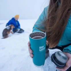 Klean Kanteen Insulated TK Wide With Café Cap 473ml - Brushed Steel -Camping Discounter K16TKWPCC EB bottle in snow lifestyle
